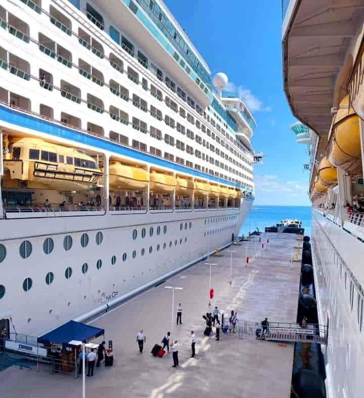 Two Royal Caribbean cruise ships docked in the same pier
