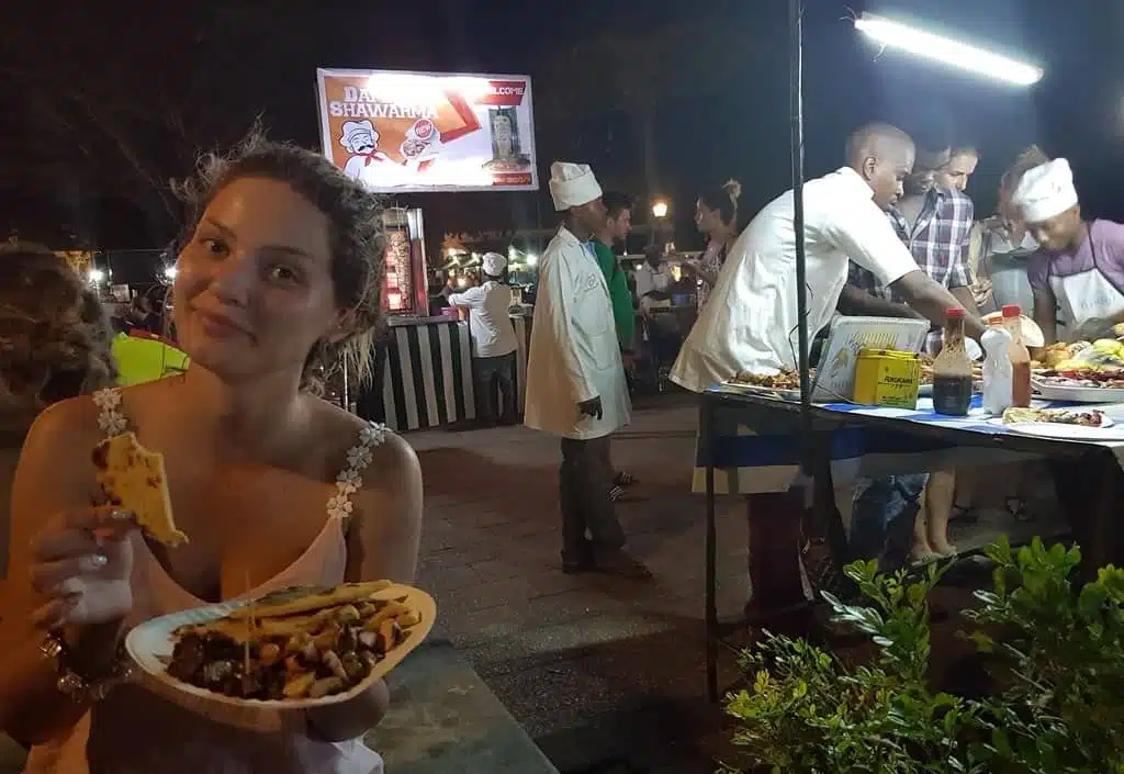 Tasting a delicious Swahili food at Forodhani Gardens at night