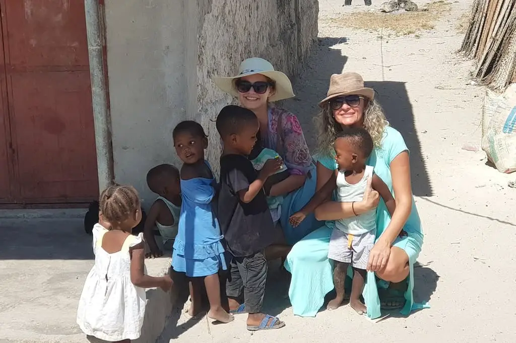 Kids from Jambiani, Zanzibar, sharing hugs with tourists