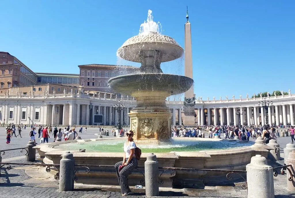 The picture of me sitting on the fountain on the St. Peter's square in Rome
