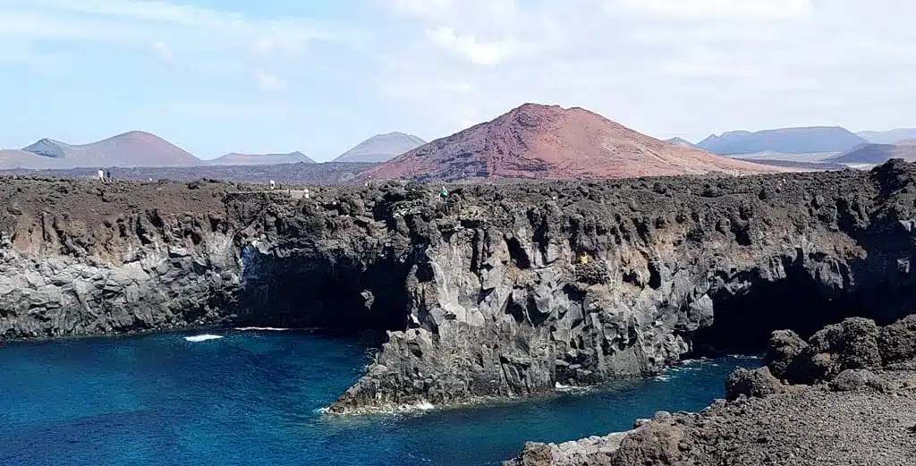 Los Hervideros and the volcanoes in the background, Lanzarote